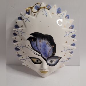 Sunburst Ceramic Mask with Butterfly Motif.  316